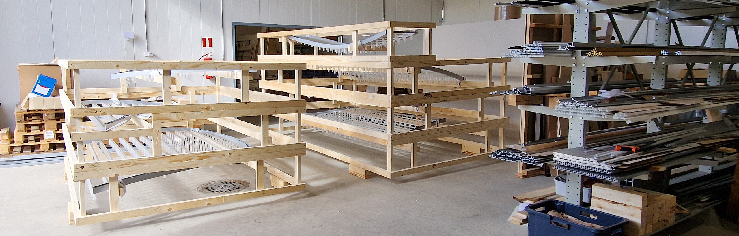 The parts of a large custom-made light fixture are waiting for packaging