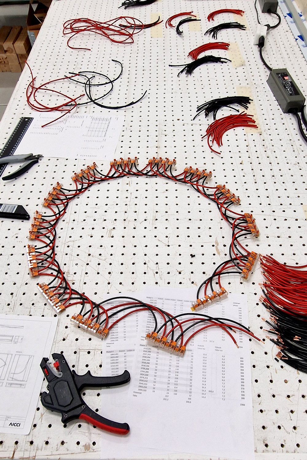 Manufacturing of the light fixture's wiring.